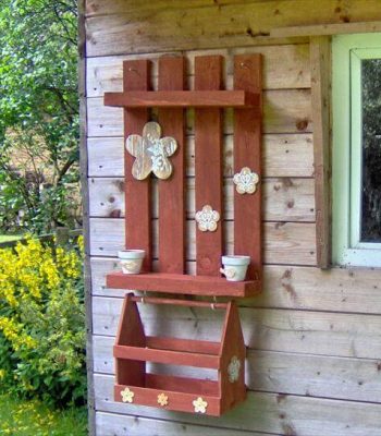 salvaged brick red garden wall rack with box